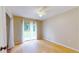 Bedroom with backyard access and light hardwood floors at 21174 Sw Peach Blossom St, Dunnellon, FL 34431
