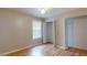 Well-lit bedroom featuring hardwood floors and double closets at 21174 Sw Peach Blossom St, Dunnellon, FL 34431