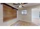 Bright dining area with wood blinds and a built-in shelving unit at 21174 Sw Peach Blossom St, Dunnellon, FL 34431