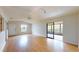 Bright living room featuring hardwood floors and sliding doors at 21174 Sw Peach Blossom St, Dunnellon, FL 34431