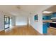 Light and airy living room with wood floors and kitchen pass-through at 21174 Sw Peach Blossom St, Dunnellon, FL 34431