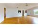 Living room with hardwood floors and kitchen view at 21174 Sw Peach Blossom St, Dunnellon, FL 34431