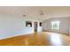 Living room with wood floors and open concept design at 21174 Sw Peach Blossom St, Dunnellon, FL 34431