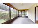 Enclosed porch with view of the backyard at 21174 Sw Peach Blossom St, Dunnellon, FL 34431