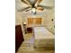 Simple bedroom with a double bed and wooden dresser at 45202 Nfs Rd 572-B, Altoona, FL 32702