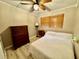 Cozy bedroom with double bed, dresser, and window coverings at 45202 Nfs Rd 572-B, Altoona, FL 32702