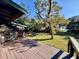 Wooden deck with view of backyard and waterfront at 45202 Nfs Rd 572-B, Altoona, FL 32702