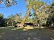 Cabin exterior with a deck and picnic table at 45202 Nfs Rd 572-B, Altoona, FL 32702