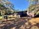 Dark brown cabin exterior with a deck at 45202 Nfs Rd 572-B, Altoona, FL 32702