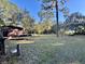 Rustic cabin nestled in a wooded area with ample lawn space at 45202 Nfs Rd 572-B, Altoona, FL 32702
