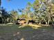 Rustic cabin nestled in a wooded area with ample lawn space at 45202 Nfs Rd 572-B, Altoona, FL 32702