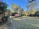 Rustic cabin nestled in a wooded area with ample lawn space at 45202 Nfs Rd 572-B, Altoona, FL 32702