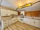 Bright kitchen with white cabinets and a farmhouse sink at 45202 Nfs Rd 572-B, Altoona, FL 32702
