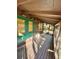 Relaxing screened porch with hanging chair and wooden flooring at 45202 Nfs Rd 572-B, Altoona, FL 32702