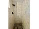 Walk-in shower with pebble flooring and beige tiles at 45202 Nfs Rd 572-B, Altoona, FL 32702