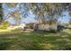 Large backyard with a screened porch and shed at 6336 Sw 60Th Ave, Ocala, FL 34474