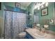 Clean bathroom with shower/tub and light blue vanity at 6336 Sw 60Th Ave, Ocala, FL 34474