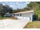 House exterior showcasing a carport and landscaping at 6336 Sw 60Th Ave, Ocala, FL 34474