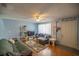 Living room with wood floors, couches, and a TV at 6336 Sw 60Th Ave, Ocala, FL 34474