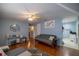 Living room featuring a futon and access to kitchen at 6336 Sw 60Th Ave, Ocala, FL 34474