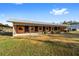 Exterior view of a barn with multiple stalls at 10555 W Highway 40, Ocala, FL 34482