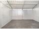 Empty horse stall with metal walls and flooring at 10555 W Highway 40, Ocala, FL 34482