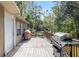 Wooden back deck with built-in seating and grill at 12511 Se 53Rd Terrace Rd, Belleview, FL 34420