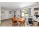 Cozy dining area with wood table and chairs, hardwood floors at 12511 Se 53Rd Terrace Rd, Belleview, FL 34420