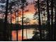 Stunning sunset view over lake from lakeside property at 14830 Se 61St Street Rd, Ocklawaha, FL 32179