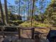 Deck overlooks serene lake, lush trees, and tranquil setting at 14830 Se 61St Street Rd, Ocklawaha, FL 32179