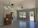 Bright dining room with tile floor and chandelier at 15641 Se 97Th Ave, Summerfield, FL 34491