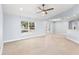 Open concept living room with tile floors, high ceilings, and access to backyard at 15896 Se 97Th Ter, Summerfield, FL 34491