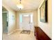 Bright entryway with tiled floor, bench, and light fixture at 16215 Sw 15Th Ct, Ocala, FL 34473