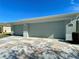 Two-car garage with light-colored doors at 16215 Sw 15Th Ct, Ocala, FL 34473