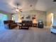 Open concept living room with a ceiling fan and neutral decor at 16215 Sw 15Th Ct, Ocala, FL 34473