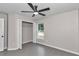 Bedroom with tile flooring, ceiling fan, and closet at 2355 Nw 57Th Pl, Ocala, FL 34475