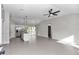 Open floor plan living room and kitchen with tile floors and ceiling fan at 2355 Nw 57Th Pl, Ocala, FL 34475