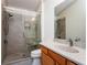 Bathroom features granite countertop and walk-in shower at 2379 Chestnut Ter, The Villages, FL 32162