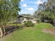 House exterior showcasing a side view and landscaping at 2605 Ne 14Th Ave, Ocala, FL 34470