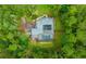 Aerial view of house, pool, and lush green surroundings at 2704 Se 31St St, Ocala, FL 34471