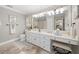 Elegant bathroom with white vanity and large mirror at 2704 Se 31St St, Ocala, FL 34471