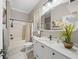 Modern bathroom with white vanity, bathtub, and stylish fixtures at 2704 Se 31St St, Ocala, FL 34471