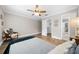 Bright bedroom with wood floors, ceiling fan, and walk-in closet at 2704 Se 31St St, Ocala, FL 34471