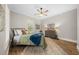 Bright bedroom with wood floors, ceiling fan, and ample natural light at 2704 Se 31St St, Ocala, FL 34471