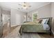 Comfortable bedroom with a queen bed and wood floors at 2704 Se 31St St, Ocala, FL 34471