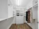 Bright walk-in closet with hanging rods and shelves at 2704 Se 31St St, Ocala, FL 34471