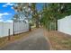 Long driveway leading to home with white fence at 2704 Se 31St St, Ocala, FL 34471