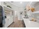White kitchen with coffee bar and built-in shelving at 2704 Se 31St St, Ocala, FL 34471