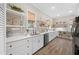 White kitchen with quartz countertops and ample shelving at 2704 Se 31St St, Ocala, FL 34471
