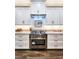 Modern kitchen with stainless steel appliances and white cabinetry at 2704 Se 31St St, Ocala, FL 34471